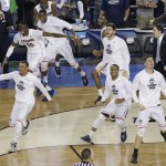 Connecticut players celebrate after their 60-54 victory over Kentucky in the NCAA Final Four tournament college basketball championship game Monday, April 7, 2014, in Arlington, Texas. (AP Photo/Tony Gutierrez)
