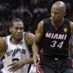  San Antonio Spurs forward Kawhi Leonard (2) tries to get past Miami Heat guard Ray Allen (34) during the second half in Game 5 of the NBA basketball finals on Sunday, June 15, 2014, in San Antonio. (AP Photo/David J. Phillip)