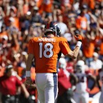 Denver Broncos quarterback Peyton Manning (18) reacts to his 500th career touchdown pass during the first half of an NFL football game against the Arizona Cardinals, Sunday, Oct. 5, 2014, in Denver. (AP Photo/Jack Dempsey)