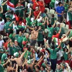 Mexican fans celebrate during the group A World Cup soccer match between Brazil and Mexico at the Arena Castelao in Fortaleza, Brazil, Tuesday, June 17, 2014. (AP Photo/Francois Xavier Marit, pool)