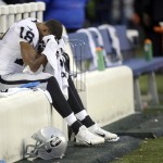 Oakland Raiders wide receiver Andre Holmes sits on the bench late in the fourth quarter of an NFL football game against the Seattle Seahawks, Sunday, Nov. 2, 2014, in Seattle. The Seahawks beat the Raiders 30-24. (AP Photo/Stephen Brashear)