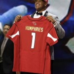 Florida offensive lineman D.J. Humphries poses for photos after being selected by the Arizona Cardinals as the 24th pick in the first round of the 2015 NFL Draft, Thursday, April 30, 2015, in Chicago. (AP Photo/Nam Y. Huh)