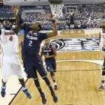 Florida center Patric Young (4) drives to the basket past Connecticut forward DeAndre Daniels (2) during the first half of the NCAA Final Four tournament college basketball semifinal game Saturday, April 5, 2014, in Dallas. (AP Photo/Chris Steppig, NCAA Photos)