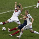 Germany's Mats Hummels, left, blocks a shot by France's Karim Benzema during the World Cup quarterfinal soccer match between Germany and France at the Maracana Stadium in Rio de Janeiro, Brazil, Friday, July 4, 2014. (AP Photo/Thanassis Stavrakis)