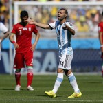 Argentina's Javier Mascherano opens his arms as he calls for attention during the group F World Cup soccer match between Argentina and Iran at the Mineirao Stadium in Belo Horizonte, Brazil, Saturday, June 21, 2014. (AP Photo/Victor R. Caivano)