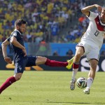 France's Yohan Cabaye, left, challenges Germany's Thomas Mueller during the World Cup quarterfinal soccer match between Germany and France at the Maracana Stadium in Rio de Janeiro, Brazil, Friday, July 4, 2014. (AP Photo/David Vincent)