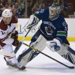 Arizona Coyotes right wing Jordan Szwarz (21) looks for a shot against Vancouver Canucks goalie Eddie Lack (31) during the first period of an NHL hockey game Thursday, April 9, 2015, in Vancouver, British Columbia. (AP Photo/The Canadian Press, Jonathan Hayward)