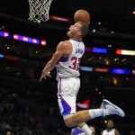 Los Angeles Clippers forward Blake Griffin goes up for a dunk as Phoenix Suns guard Gerald Green and Clippers guard Reggie Bullock watch during the first half of a preseason NBA basketball game, Wednesday, Oct. 22, 2014, in Los Angeles. (AP Photo/Mark J. Terrill)