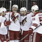 Arizona Coyotes' Sam Gagner, second from right, celebrates with teammates Antoine Vermette (50), Oliver Ekman-Larsson (23) and Keith Yandle (3) after scoring during the first period of an NHL hockey game against the New York Rangers on Thursday, Feb. 26, 2015, in New York. (AP Photo/Frank Franklin II)