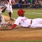 Philadelphia Phillies' Cesar Hernandez is safe at home on a single by Freddy Galvis before Arizona Diamondbacks catcher Tuffy Gosewisch can make the tag in the seventh inning of a baseball game, Friday, May 15, 2015, in Philadelphia. The Phillies won 4-3. (AP Photo/Laurence Kesterson)