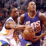 Golden State Warriors forward Harrison Barnes (40) strips the ball from Phoenix Suns guard Archie Goodwin in the fourth quarter during an NBA basketball game, Monday, March 9, 2015, in Phoenix. (AP Photo/Rick Scuteri)