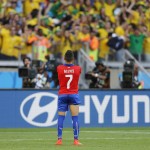 Chile's Alexis Sanchez reacts after missing a penalty during penalty shoot-out in the World Cup round of 16 soccer match between Brazil and Chile at the Mineirao Stadium in Belo Horizonte, Brazil, Saturday, June 28, 2014. Brazil won 3-2 on penalties.(AP Photo/Frank Augstein)