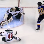 Minnesota Wild goalie Devan Dubnyk, top left, makes a save on a shot by St. Louis Blues' Alexander Steen, right, as Wild's Jared Spurgeon, bottom, watches during the second period in Game 5 of an NHL hockey first-round playoff series, Friday, April 24, 2015, in St. Louis. (AP Photo/Jeff Roberson)