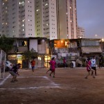  Residetns play soccer during the "Rebelde Cup" in Favela Moinho in Sao Paulo, Brazil, Wednesday, June 11, 2014. Residents of the Favela organized the soccer tournament in protest against the World Cup, claiming that the resources spent on the World Cup tournament would have been better spent in giving them access to potable water, electricity and a drainage sewer system. (AP Photo/Rodrigo Abd)