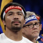 Manny Pacquiao, from the Philippines, gets ready before the welterweight title fight against Floyd Mayweather Jr., on Saturday, May 2, 2015 in Las Vegas. (AP Photo/Isaac Brekken)