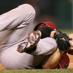 Arizona Diamondbacks' Tuffy Gosewisch clutches his left knee after being injured running out a ground out in sixth inning action during a game between the St. Louis Cardinals and the Arizona Diamondbacks on Wednesday, May 27, 2015, at Busch Stadium in St. Louis. (Chris Lee/St. Louis Post-Dispatch via AP)