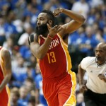 Houston Rockets' James Harden (13) celebrates after sinking a3-point basket against the Dallas Mavericks in the second half of Game 3 in an NBA basketball first-round playoff series Friday, April 24, 2015, in Dallas. The Rockets won 130-128. (AP Photo/Tony Gutierrez)