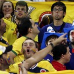 Japan's fans look dejected as Colombia's celebrate after the group C World Cup soccer match between Japan and Colombia at the Arena Pantanal in Cuiaba, Brazil, Tuesday, June 24, 2014. Colombia won 4-1.(AP Photo/Dolores Ochoa)