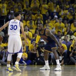 Cleveland Cavaliers forward LeBron James, right, guards Golden State Warriors guard Stephen Curry (30) during the first half of Game 1 of basketball's NBA Finals in Oakland, Calif., Thursday, June 4, 2015. (AP Photo/Ben Margot)