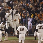 San Francisco Giants first baseman Brandon Belt, upper left, high fives third baseman Pablo Sandoval and teammates after the Giants beat Washington Nationals in Game 4 of baseball's NL Division Series in San Francisco, Tuesday, Oct. 7, 2014. The Giants won 3-2 to win the series. (AP Photo/Jeff Chiu)