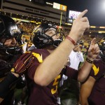 Arizona State's Zane Gonzalez (5) points to the sky as he celebrates his game-winning field goal against Utah with teammate Shane Till, left, and Richie Becerra (49) after overtime in an NCAA college football game on Saturday, Nov. 1, 2014, in Tempe, Ariz. Arizona State defeated the Utah 19-16 in overtime. (AP Photo/Ross D. Franklin)