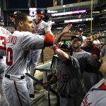  Washington Nationals Ian Desmond, second from left, celebrates after hitting a solo homerun against the Arizona Diamondbacks in the fourth inning during a baseball game, Monday, May 12, 2014, in Phoenix. (AP Photo/Rick Scuteri)