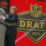 Penn State offensive lineman Donovan Smith celebrates with NFL commissioner Roger Goodell after being selected by the Tampa Bay Buccaneers as the 34th pick in the second round of the 2015 NFL Football Draft, Friday, May 1, 2015, in Chicago. (AP Photo/Charles Rex Arbogast)