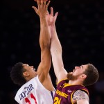 Richmond forward Deion Taylor, left, and ASU forward Eric Jacobsen, right, reach for the tipoff at the start of the first half of an NCAA college basketball game during the NIT tournament at Robins Center in Richmond, Va., on Sunday, March 22, 2015. (AP Photo/Zach Gibson)