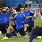 Greece's players stretch during a training session of Greece at Arena das Dunas in Natal, Brazil, Wednesday, June 18, 2014. Greece play in group C of the 2014 soccer World Cup. (AP Photo/Shuji Kajiyama)