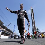 Will Power, of Australia, waves to fans as he walks to his car before the start of the 98th running of the Indianapolis 500 IndyCar auto race at the Indianapolis Motor Speedway in Indianapolis, Sunday, May 25, 2014. (AP Photo/AJ Mast)