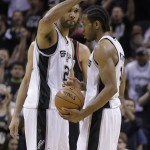 San Antonio Spurs' Tim Duncan (21) celebrates with teammate Kawhi Leonard, right, during the second half of Game 2 of a Western Conference semifinal NBA basketball playoff series against the Portland Trail Blazers, Thursday, May 8, 2014, in San Antonio. San Antonio won 114-97. (AP Photo/Eric Gay)