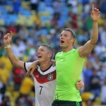 Germany's Bastian Schweinsteiger, left, and Germany's goalkeeper Manuel Neuer celebrate after the World Cup quarterfinal soccer match between Germany and France at the Maracana Stadium in Rio de Janeiro, Brazil, Friday, July 4, 2014. Germany won the match 1-0. (AP Photo/David Vincent)