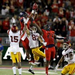 Arizona wide receiver Cayleb Jones (1) recovers the on side kick against Southern California during the second half of an NCAA college football game, Saturday, Oct. 11, 2014, in Tucson, Ariz. Southern California defeated Arizona 28-26. (AP Photo/Rick Scuteri)