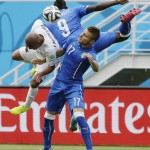 Uruguay's Egidio Arevalo Rios collides with Italy's Ciro Immobile and Mario Balotelli (9) during the group D World Cup soccer match between Italy and Uruguay at the Arena das Dunas in Natal, Brazil, Tuesday, June 24, 2014. (AP Photo/Ricardo Mazalan)