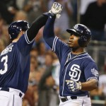 San Diego Padres' Justin Upton, right, and Derek Norris celebrate after Upton's two-run home run against the Arizona Diamondbacks during the fifth inning of a baseball game Saturday, June 27, 2015, in San Diego. (AP Photo/Lenny Ignelzi)
