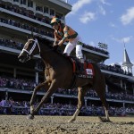Kerwin D. Clark rides Lovely Maria to victory during the 141st running of the Kentucky Oaks horse race at Churchill Downs Friday, May 1, 2015, in Louisville, Ky. (AP Photo/David J. Phillip)