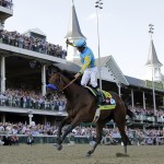 Victor Espinoza rides American Pharoah to victory in the 141st running of the Kentucky Derby horse race at Churchill Downs Saturday, May 2, 2015, in Louisville, Ky. (AP Photo/David J. Phillip)