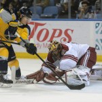 Buffalo Sabres center Tyler Ennis, left, skates around Arizona Coyotes goaltender Mike Smith for a goal during the first period of an NHL hockey game Thursday, March 26, 2015, in Buffalo, N.Y. (AP Photo/Gary Wiepert)