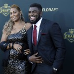 Alabama defensive back Landon Collins poses for photos his mother April Justin, upon arriving for the first round of the 2015 NFL Football Draft at the Auditorium Theater of Roosevelt University, Thursday, April 30, 2015, in Chicago. (AP Photo/Charles Rex Arbogast)