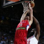 Serbia's Nikola Kalinic pushes the ball up the basket against United States' James Harden during the final World Basketball match between the United States and Serbia at the Palacio de los Deportes stadium in Madrid, Spain, Sunday, Sept. 14, 2014. (AP Photo/Daniel Ochoa de Olza)