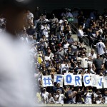 Fans hold up a sign as New York Yankees' Alex Rodriguez comes up to bat during the third inning of the baseball game against the Toronto Blue Jays at Yankee Stadium, Monday, April 6, 2015 in New York. (AP Photo/Seth Wenig)