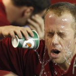 Arizona Diamondbacks' Aaron Hill splashes water on his face in the dugout prior to a baseball game against the New York Mets on Wednesday, April 16, 2014, in Phoenix. (AP Photo/Ross D. Franklin)