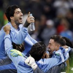 Uruguay's Luis Suarez celebrates after the group D World Cup soccer match between Uruguay and England at the Itaquerao Stadium in Sao Paulo, Brazil, Thursday, June 19, 2014. Uruguay won the match 2-1. (AP Photo/Matt Dunham)