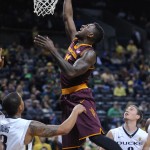 Arizona State's Savon Goodman (11) shoots against Oregon's Joseph Young, left, during the first half of an NCAA college basketball game in Corvallis, Ore., Saturday, Jan. 10, 2015. (AP Photo/Greg Wahl-Stephens)