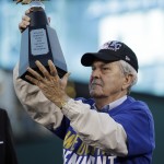 Kansas City Royals owner David Glass holds up the trophy after the Royals defeated the Baltimore Orioles 2-1 in Game 4 of the American League baseball championship series Wednesday, Oct. 15, 2014, in Kansas City, Mo. The Royals advance to the World Series. (AP Photo/Matt Slocum)
