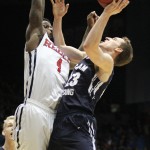Brigham Young's Skyler Halford (23) shoots against Mississippi's M.J. Rhett (4) in the second half of a first round NCAA tournament game, Tuesday, March 17, 2015 in Dayton, Ohio. (AP Photo/Skip Peterson)