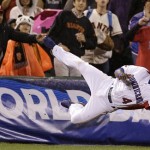 The Dominican Republic's Miguel Tejada (4) catches a foul ball hit by Puerto Rico's Jesus Feliciano during the seventh inning of the championship game of the World Baseball Classic in San Francisco, Tuesday, March 19, 2013. (AP Photo/Eric Risberg)