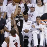 San Antonio Spurs' Danny Green (4) shoots over Miami Heat's Dwyane Wade (3) during the first half in Game 7 of the NBA basketball championships, Thursday, June 20, 2013, in Miami. (AP Photo/Wilfredo Lee)
