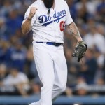 Los Angeles Dodgers pitcher Brian Wilson pumps his fist at the end of the top of the eighth inning against the Atlanta Braves in Game 4 of the National League baseball division baseball series Monday, Oct. 7, 2013, in Los Angeles. (AP Photo/Danny Moloshok)