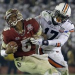  Auburn's Kris Frost tackles Florida State's Jameis Winston on a run during the second half of the NCAA BCS National Championship college football game Monday, Jan. 6, 2014, in Pasadena, Calif. (AP Photo/David J. Phillip)